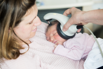 Newborn baby having her hearing tested as part of the Universal Newborn Hearing Screening and Early Intervention Programme (UNHSEIP)